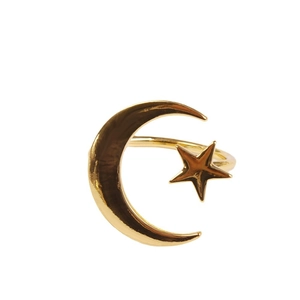 Adjustable golden napkin ring featuring a celestial crescent moon and star design