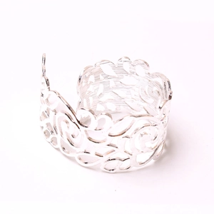 Elegant hollowed-out silver rose pattern napkin ring with intricate floral metallic design