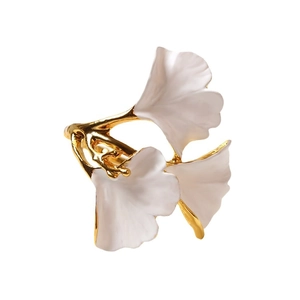Elegant gold ginkgo leaf napkin ring with white enamel finish for formal table settings
