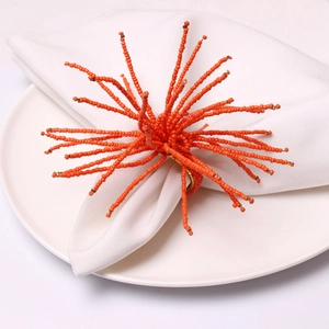 Handmade orange beaded coral-shaped napkin ring with gold ring for table decor