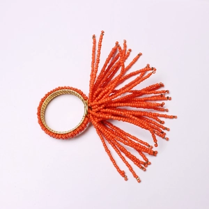 Handmade bohemian orange beaded napkin ring with elegant gold wire for table decor