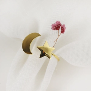 Minimalist golden star and crescent moon adjustable open ring with a polished metal finish