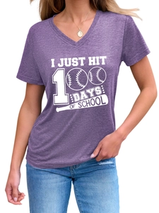 Detail of purple V-neck T-shirt with I JUST HIT 100 DAYS OF SCHOOL baseball print