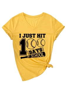 Detail of yellow V-neck t-shirt with 100 days of school baseball graphic and knotted hem