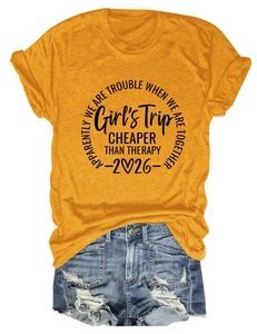 Detail of mustard yellow cotton T-shirt with Girl's Trip print and distressed denim shorts