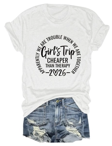 Flat lay of white cotton T-shirt with Girl's Trip print and distressed denim shorts