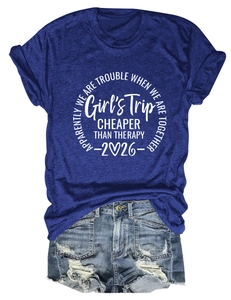 Detail of Girl's Trip printed navy tee paired with distressed light blue denim shorts