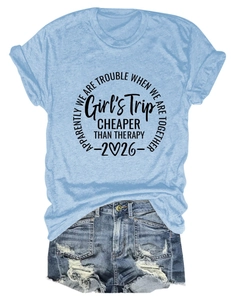 Flat lay of light blue Girl's Trip cotton t-shirt with ripped denim denim shorts