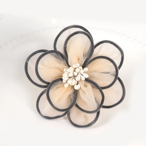 Handmade champagne organza flower napkin ring with black edges and white pearls