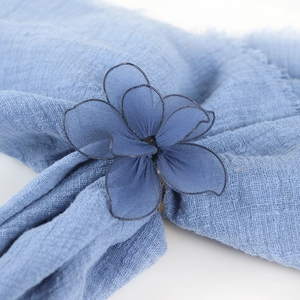 Blue mesh fabric flower napkin ring with silver metal edges for elegant table settings