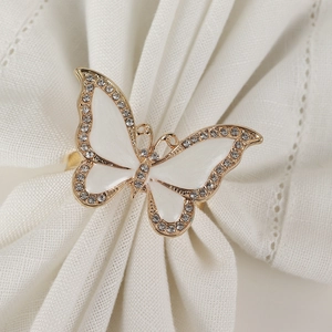 Elegant butterfly napkin ring with white enamel wings and sparkling crystal accents