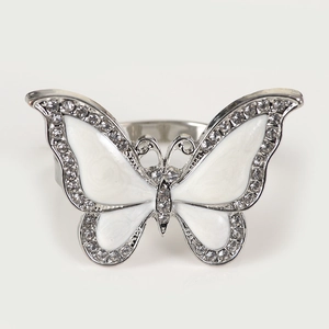 Elegant butterfly napkin ring with white enamel wings and sparkling inlaid crystals
