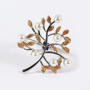 Silver branch napkin ring with gold leaves and white pearls for elegant table setting
