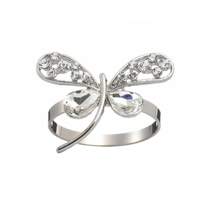 Silver dragonfly napkin ring with sparkling crystals and bow-tie shaped wings on white background