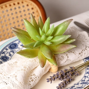 Artificial succulent napkin ring with faux echeveria and natural rattan weave loop
