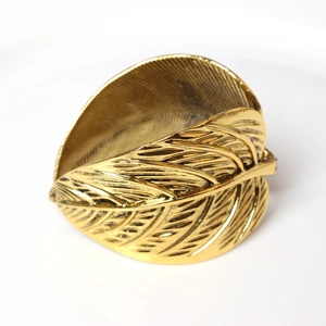 Elegant gold plated double leaf napkin ring with intricate carved texture and polished finish