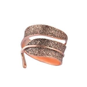 Rose gold leaf napkin ring with intricate vein texture and adjustable spiral design