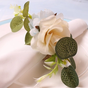 Handmade woven napkin ring with champagne rose and blue flowers for elegant table settings