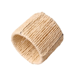 Handwoven straw napkin ring in natural beige for rustic table setting decoration