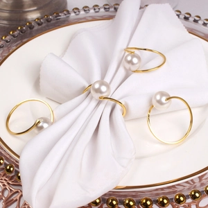 Set of 4 gold metal napkin rings with white pearl accents for luxury table decor