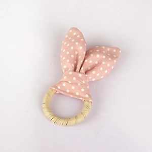 Handmade woven cotton rabbit ear baby teether ring with pink polka dot fabric pattern