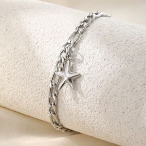 Punk style stainless steel star anklet featuring a polished star pendant and Figaro chain