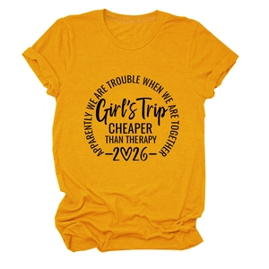Detail of yellow cotton t-shirt with Girls Trip 2026 slogan print and rolled sleeves
