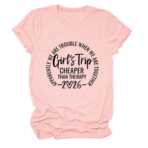 Detail view of pink cotton t-shirt featuring black artistic lettering and heart graphic