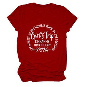 Close-up of red cotton T-shirt featuring white Girls Trip circle graphic and slogan