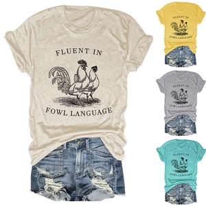 Detail view of multi-color casual t-shirts with rooster print and fowl language quote