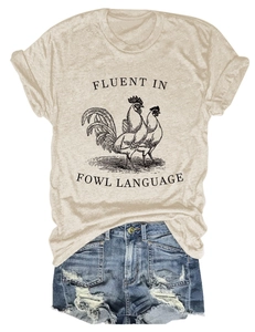 Flat lay of apricot T-shirt with fowl language rooster print and ripped denim shorts