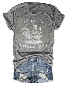 Close-up of grey t-shirt with rooster graphic and Fluent in Fowl Language text design