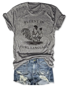 Flat lay of grey t-shirt with rooster graphic and Fluent in Fowl Language slogan