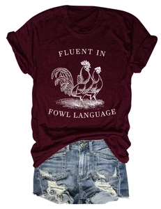 Close-up of maroon cotton t-shirt with chicken print and distressed denim shorts
