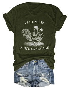 Flat lay of olive green t-shirt with rooster print and distressed denim shorts detail
