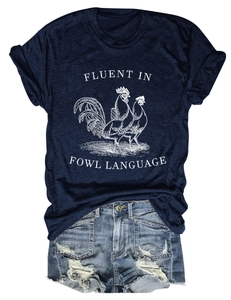 Detail of navy t-shirt with rooster graphic and distressed denim shorts flat lay view