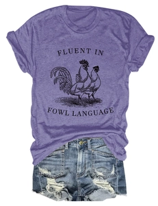 Close-up of purple t-shirt featuring fluent in fowl language print with denim shorts