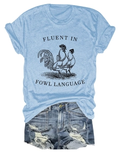 Detail of light blue fowl language t-shirt paired with distressed denim shorts
