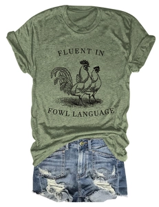 Army green t-shirt with rooster graphic and distressed denim shorts flat lay outfit