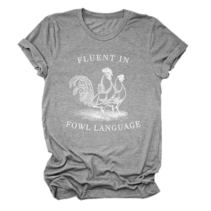 Close-up of rooster graphic print and Fluent in Fowl Language text on gray T-shirt