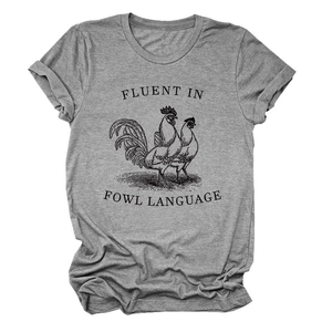 Detail of grey t-shirt featuring fluent in fowl language graphic print with roosters
