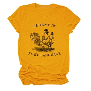 Detail of ginger yellow cotton t-shirt featuring fluent in fowl language print and texture