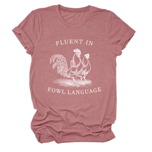 Detail of dusty rose cotton t-shirt featuring white fluent in fowl language print