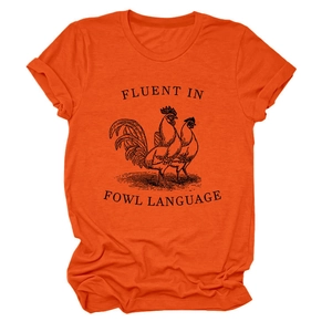 Detailed view of the humorous fowl language print on a bright orange cotton t-shirt