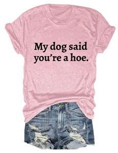 Flat lay of pink t-shirt with slogan and distressed denim shorts summer outfit