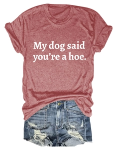 Flat lay of a red graphic tee with white lettering and distressed blue denim shorts