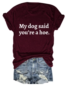 Flat lay of burgundy t-shirt with My dog said you're a hoe print and denim shorts