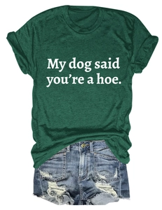Detail of dark green t-shirt with slogan My dog said you're a hoe and denim shorts