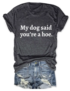 Close-up of gray t-shirt with My dog said you're a hoe text and denim shorts