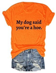 Detail of orange crewneck t-shirt with letter print and distressed denim shorts